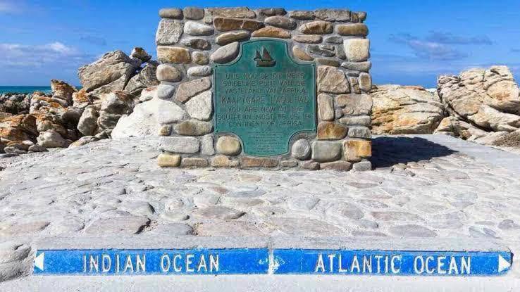 Cape Point is the southernmost tip of the Cape Peninsula, about 50–60 km south of Cape Town. It offers dramatic cliffs, strong winds, fynbos vegetation, wildlife (like baboons and antelope), and stunning views over the ocean.